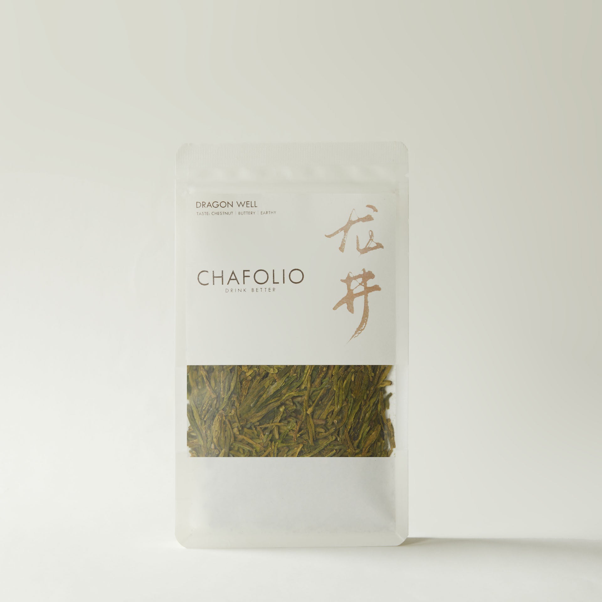 A clear, resealable package of Chafolio's Dragon Well tea from West Lake features loose leaves and is shown against a plain light background.