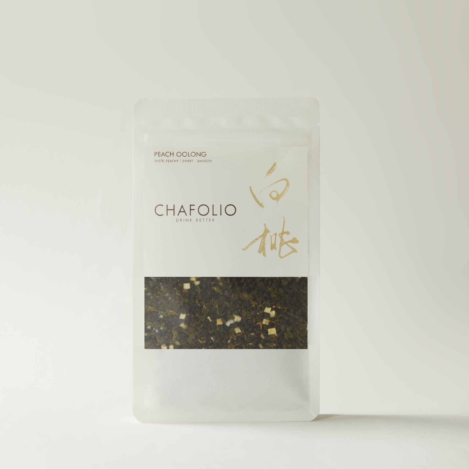 A clear, resealable bag labeled "Chafolio Peach Oolong" contains loose leaf Peach Oolong tea with visible dried peach pieces.