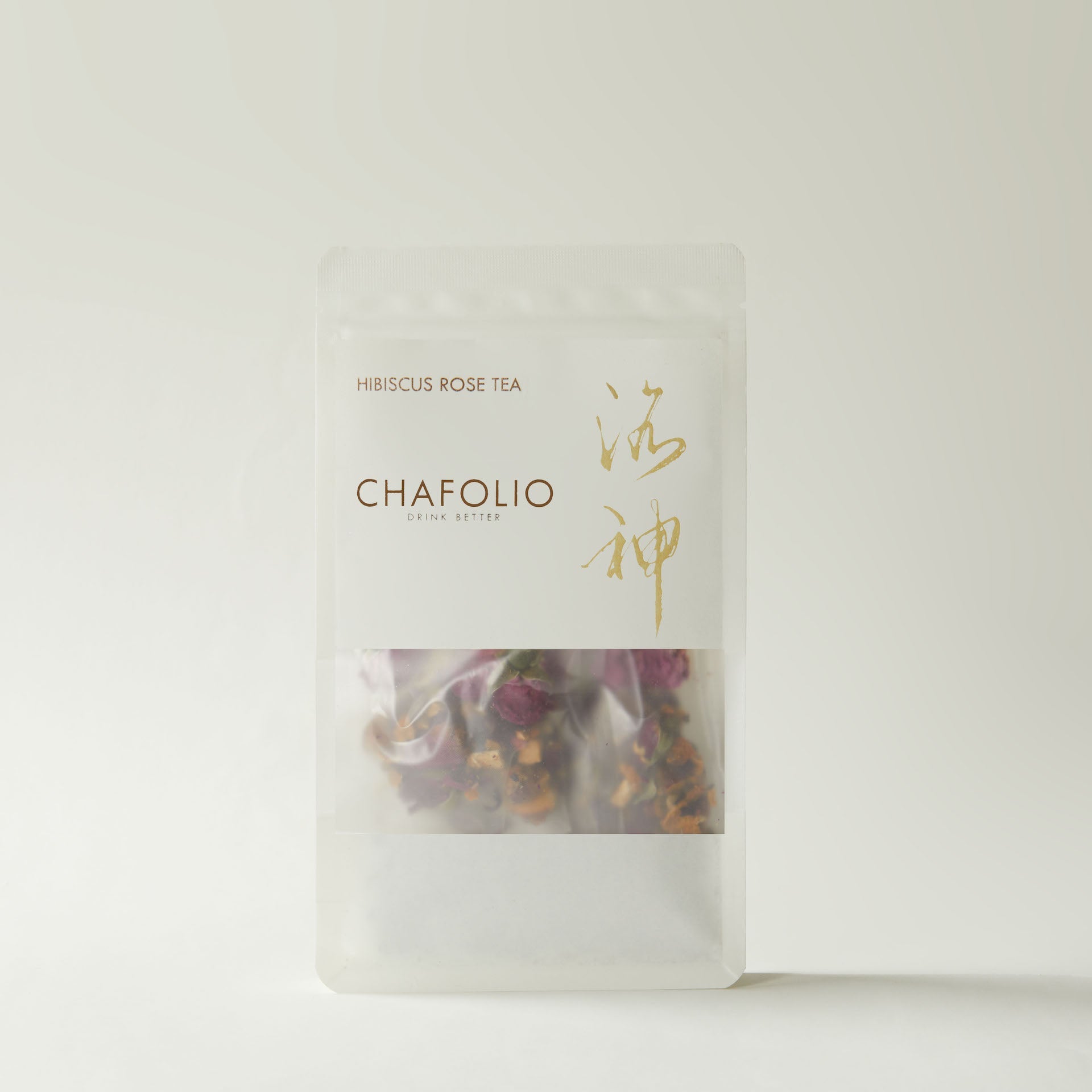A clear, resealable Chafolio Hibiscus Rose Tea bag contains dried hibiscus and rose petals, inspired by traditional Chinese medicine, shown against a neutral background.